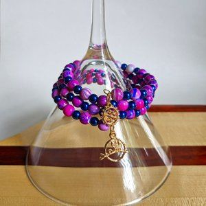 Purple and blue memory wire bracelet with gold finishing charms